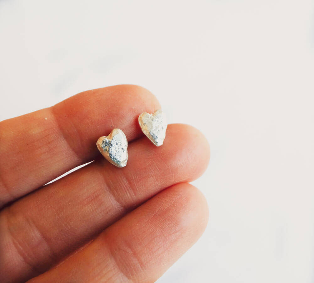 Sterling silver heart stud earrings.