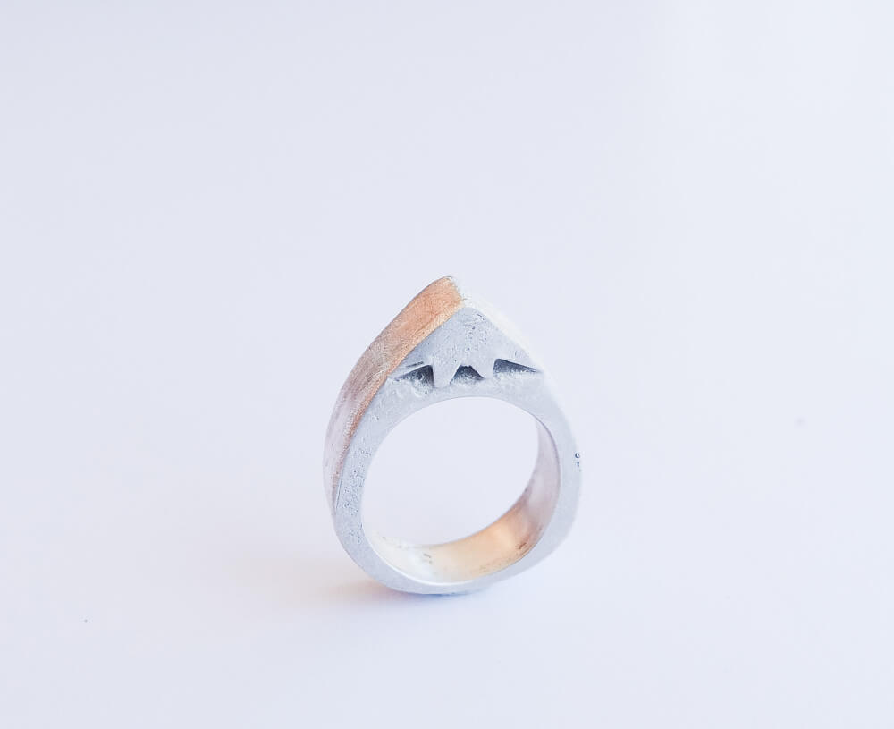 Hollow form mountain ring and three peaks mountain ring, initially hand-carved in wax and cast in sterling silver.