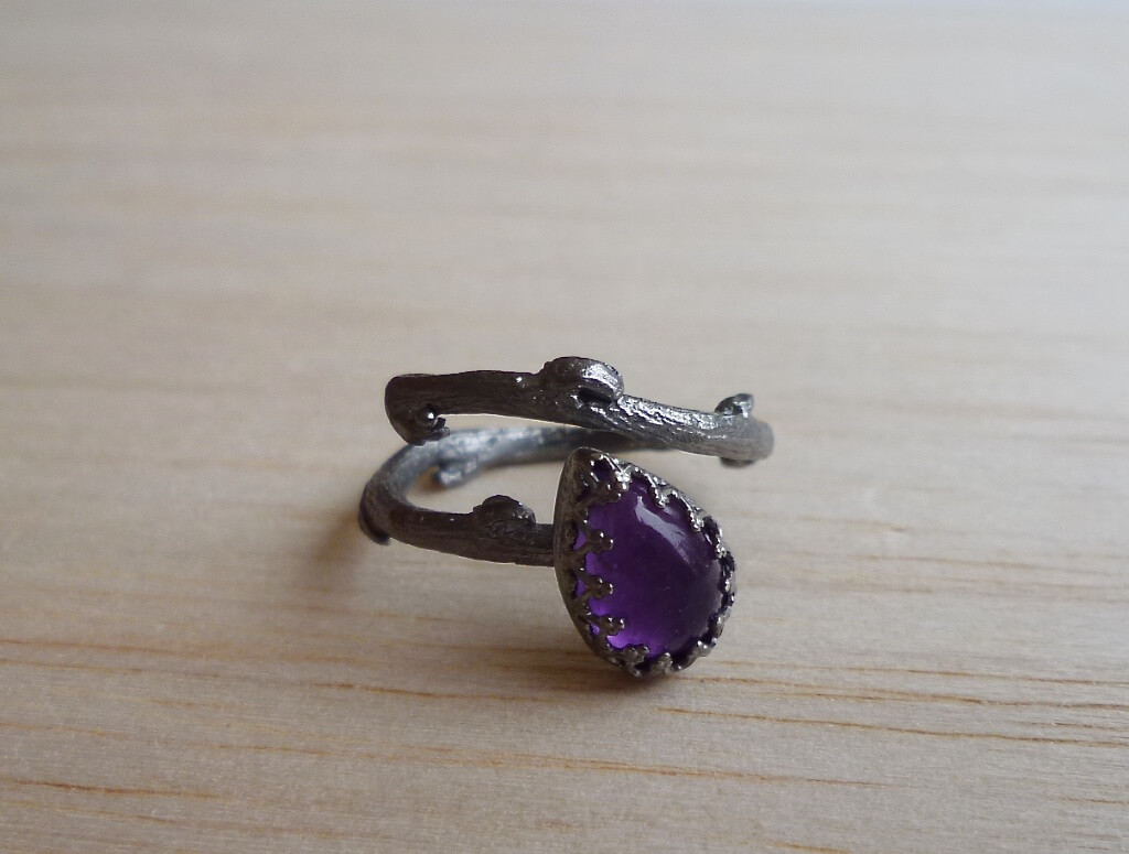 These amethyst rings are hand fabribated in sterling silver. The first ring has a "branch" band and it's black platinum plated. The second ring is also adjustable with a fine silver "pebble". Both rings are also available through my Etsyshop.