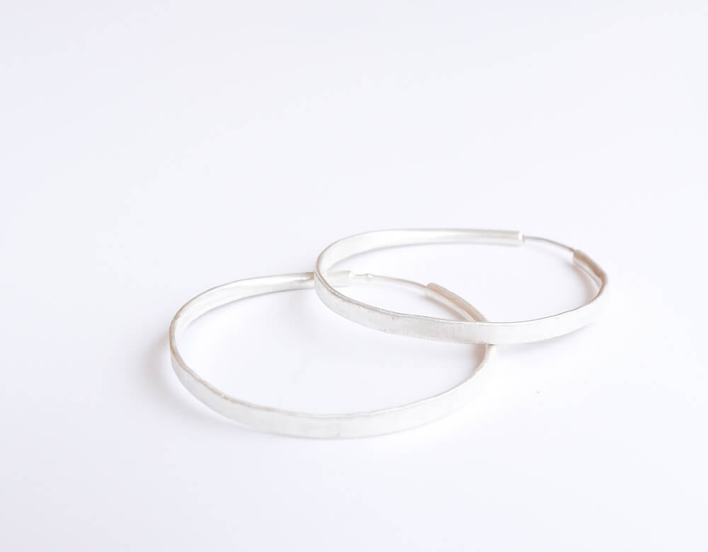 If you are into hoops, I 'm sure you're going to love these medium size sterling silver hoops with satin matte finish.