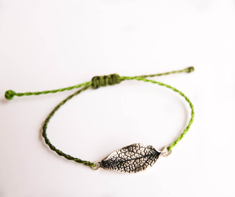 Here's a sterling silver sage leaf, finished with twisted cords in shades of olive green.