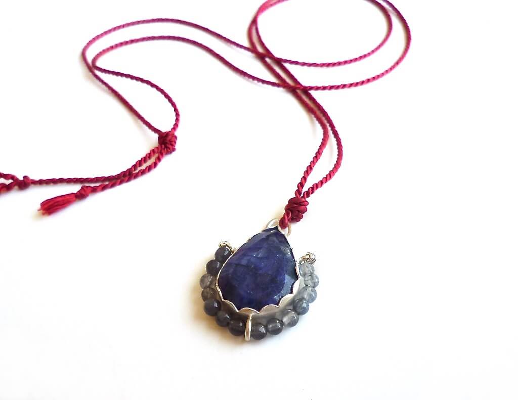 Blue beryl pendant with labradorite and silk cord.