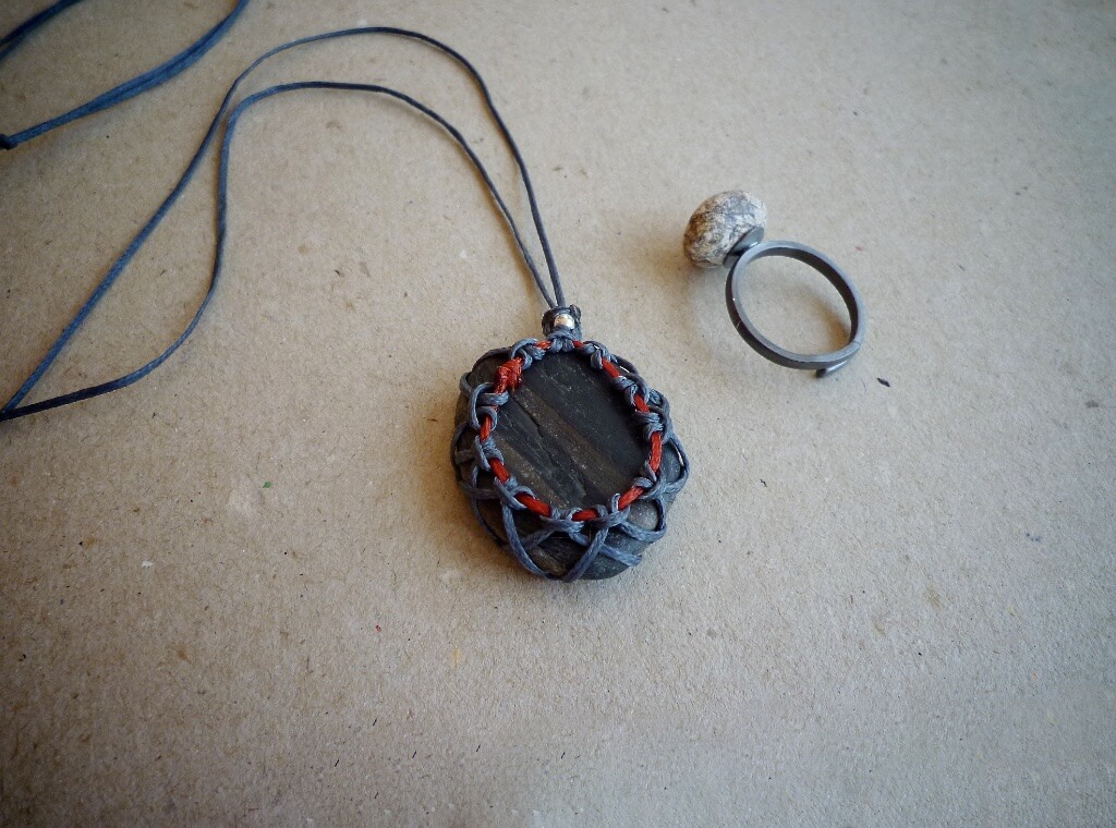 Macrame pebble pendant with waxed linen cord.