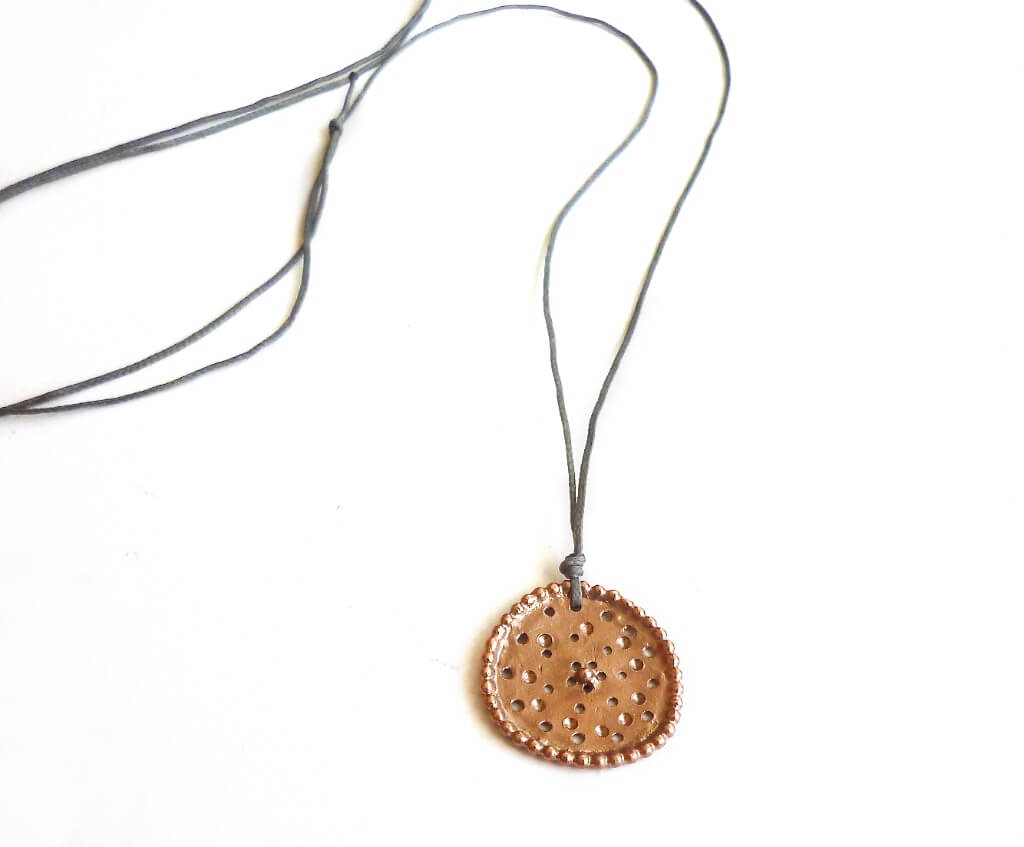 A rose gold plated version of the oval pendant.