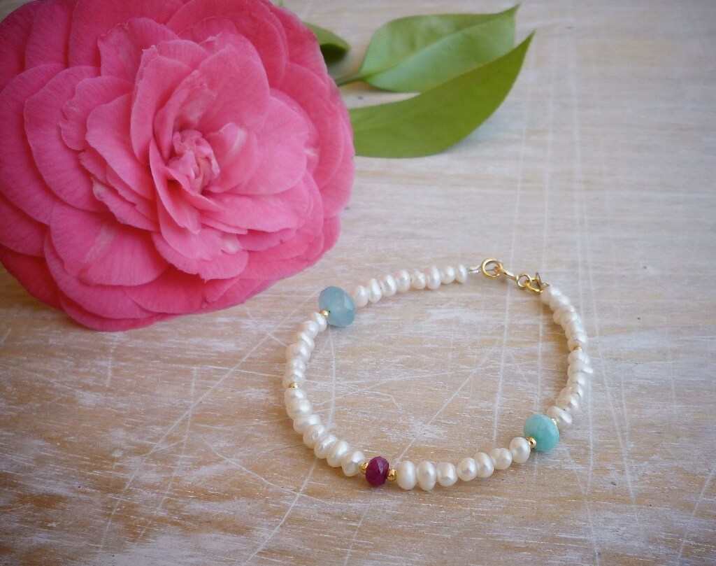 Even my camelia decided to bloom this year! Here'a a pearl bracelet with ruby, amazonite and jade.