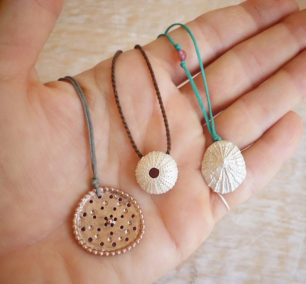 The new versions of the urchin and oval pendants, together with limpet pendant, which is strung on a turquoise cord.