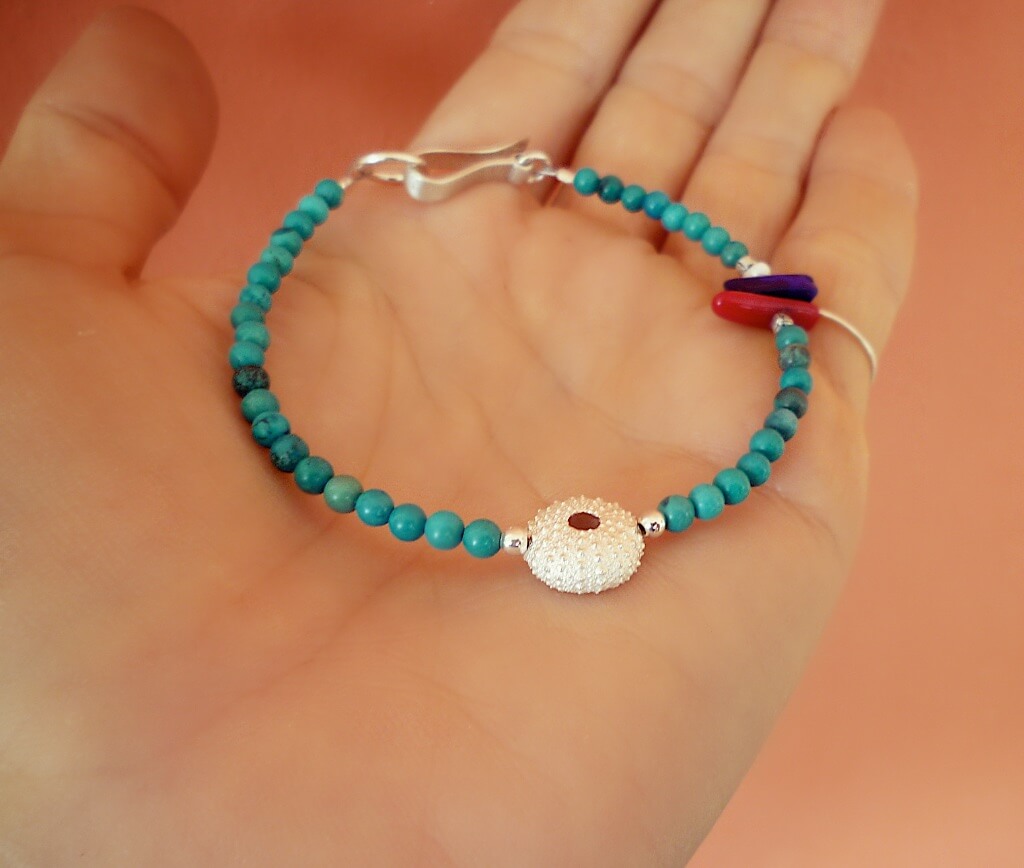 Sea urchin bracelet with turquoise, coral, lapis lazuli and pearl.